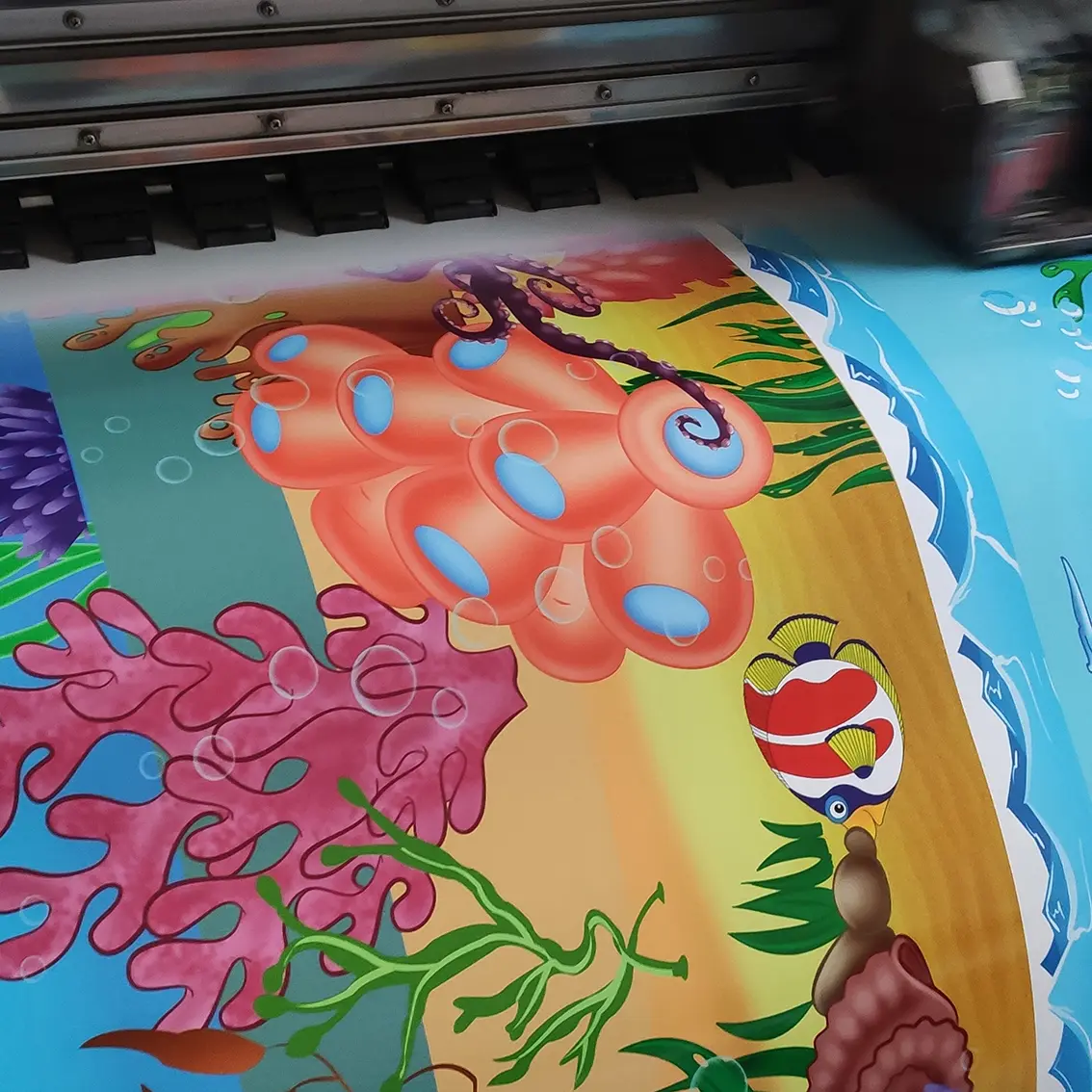Colorful vinyl sticker with underwater cartoon illustration being printed